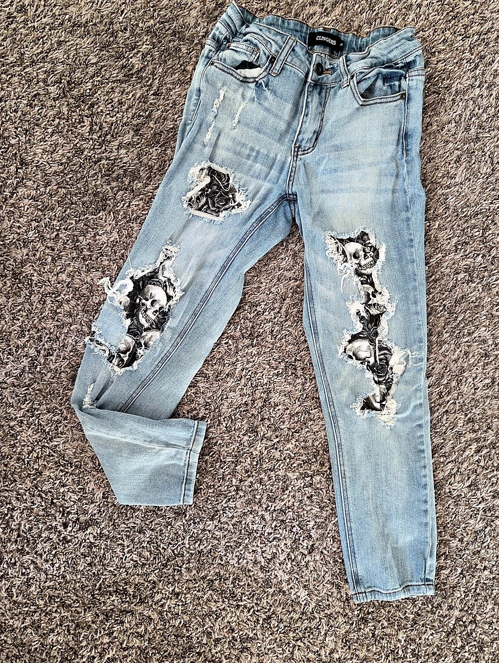 CLINGERS Distressed Skull Graphic Slim Jeans in Blue